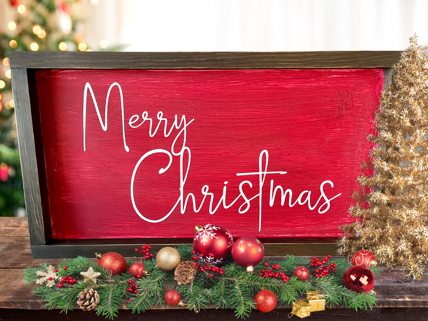 A sign pained red with Merry Christmas in a thin script font