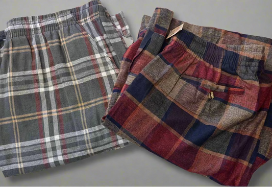 Two plaid flannel cargo shorts on a table top